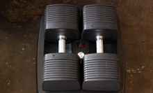 set of adjustable dumbbells with number 15 on LED panel