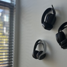 Picture of gaming headsets hanging on a wall