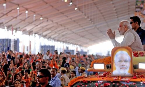 Prime Minister Narendra Modi exchanges greetings with a crowd in Jaipur.