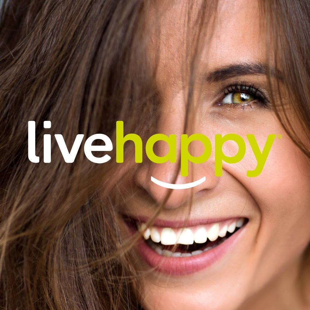 A closeup of a smiling brunette woman with Live Happy text overlaid onto of the image.