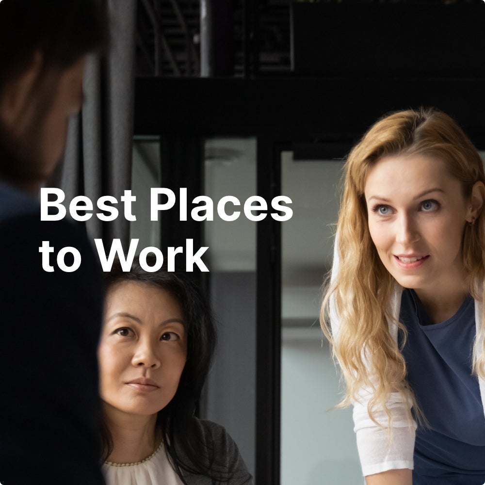 Two women and a man are collaborating in an office. Best Places to Work is overlaid on top of the image.