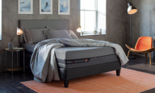 Layla Hybrid Mattress on bed frame with sheets and pillows