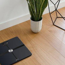 a digital scale on hardwood flooring