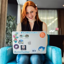 woman sitting on chair using laptop