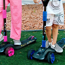 close up of kids playing on Kimi scooters