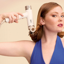 Woman holding Shark SpeedStyle dryer 