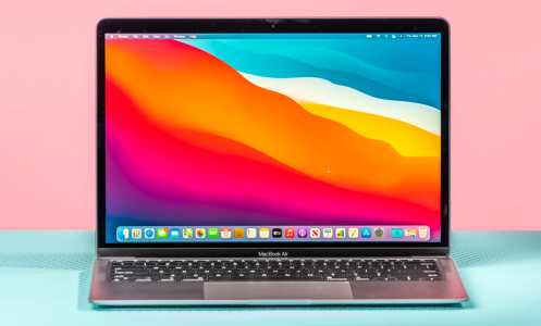 the m1 apple macbook air against a pastel pink and blue background