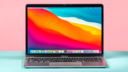 the m1 apple macbook air against a pastel pink and blue background